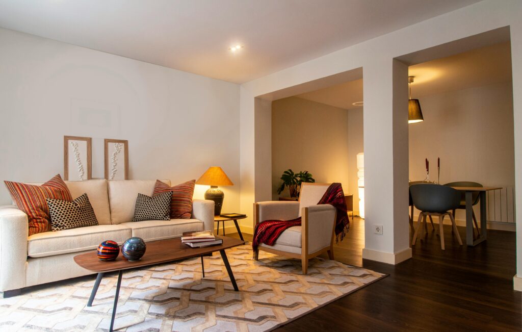 Stylish living room featuring a cozy sofa and warm lighting for a homely ambiance.